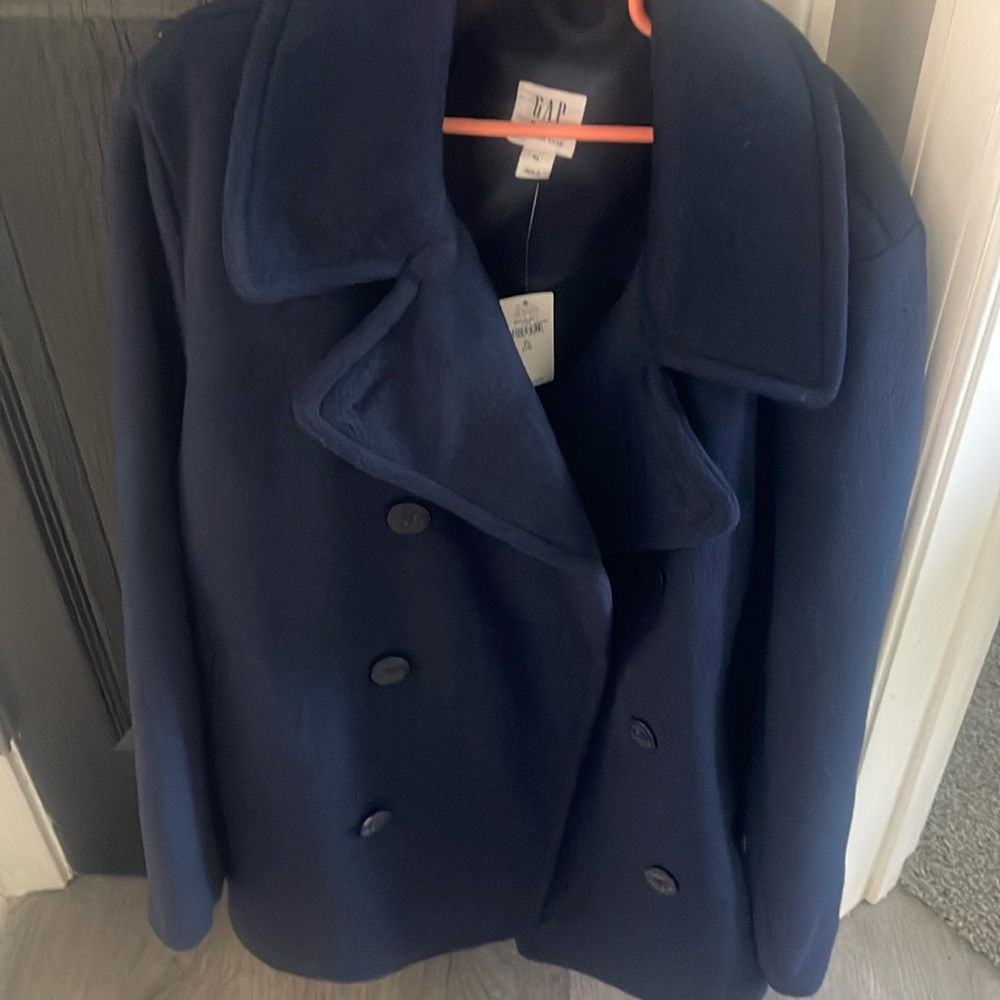 Never worn navy blue boy’s peacoat, size XL